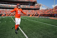 Cincinnati Bengals defensive end Trey Hendrickson celebrates coming off the field after an...