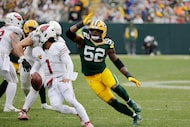 Green Bay Packers defensive end Rashan Gary (52) pressures Arizona Cardinals quarterback...