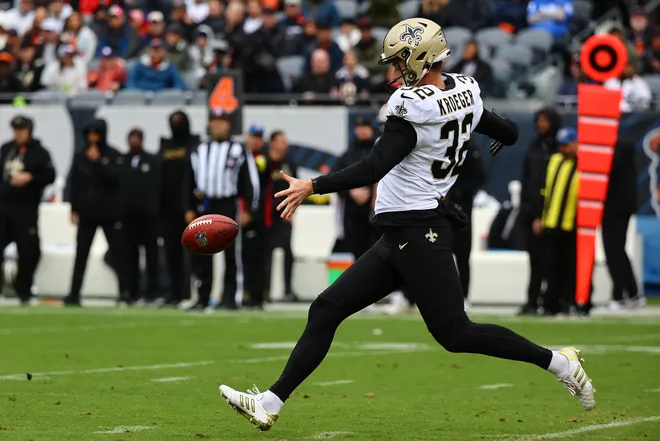 Oct 19, 2025; Chicago, Illinois, USA; New Orleans Saints punter Kai Kroeger (32) punts the ball to the Chicago Bears during the second half at Soldier Field. Mandatory Credit: Mike Dinovo-Imagn Images