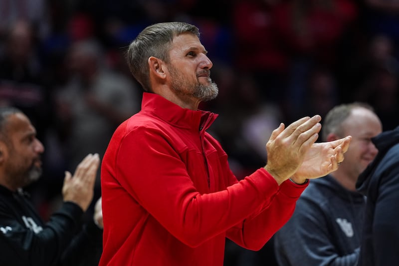 New Utah offensive coordinator Jordan Gross claps during Utah-BYU basketball game at the Huntsman Center in Salt Lake City, Utah on Saturday, Jan. 10, 2026.