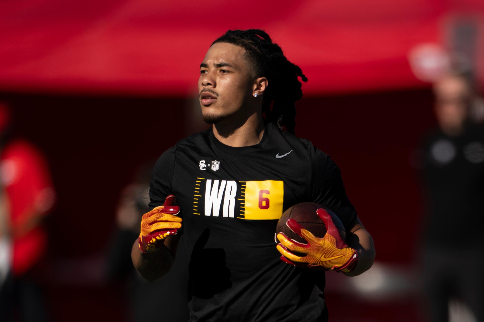 Wide receiver Makai Lemon runs with the ball during USC's pro day on March 12.