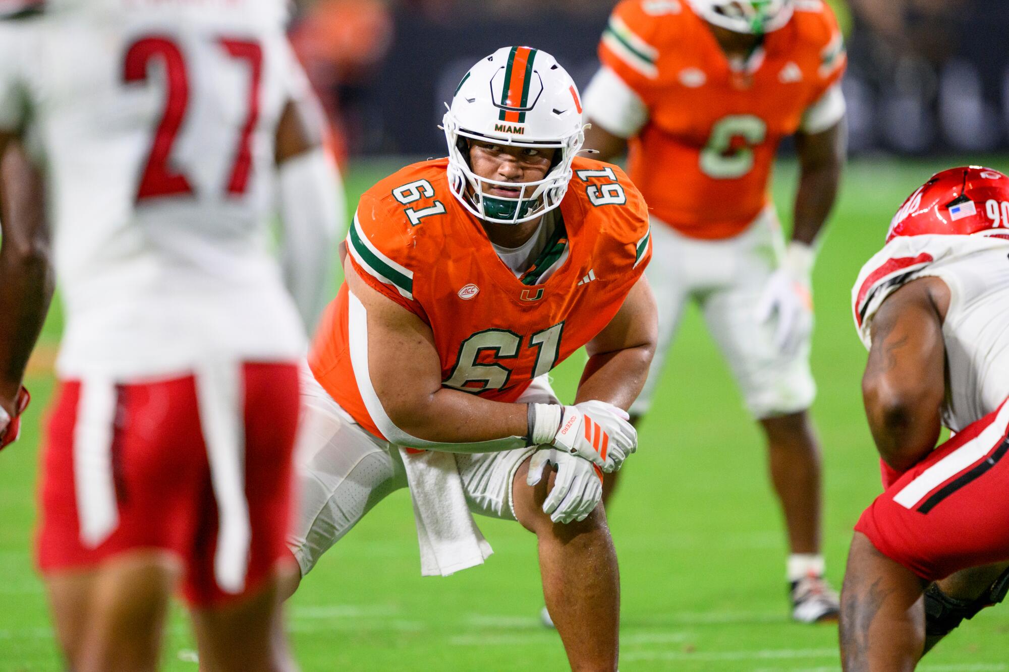 Miami offensive lineman Francis Mauigoa prepares for a snap against Louisville in October.