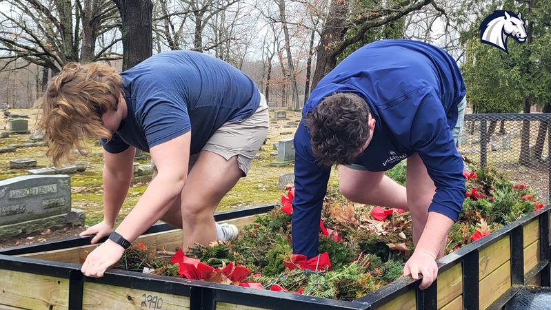 Charger football team participates in Wreaths Across America cleanup program