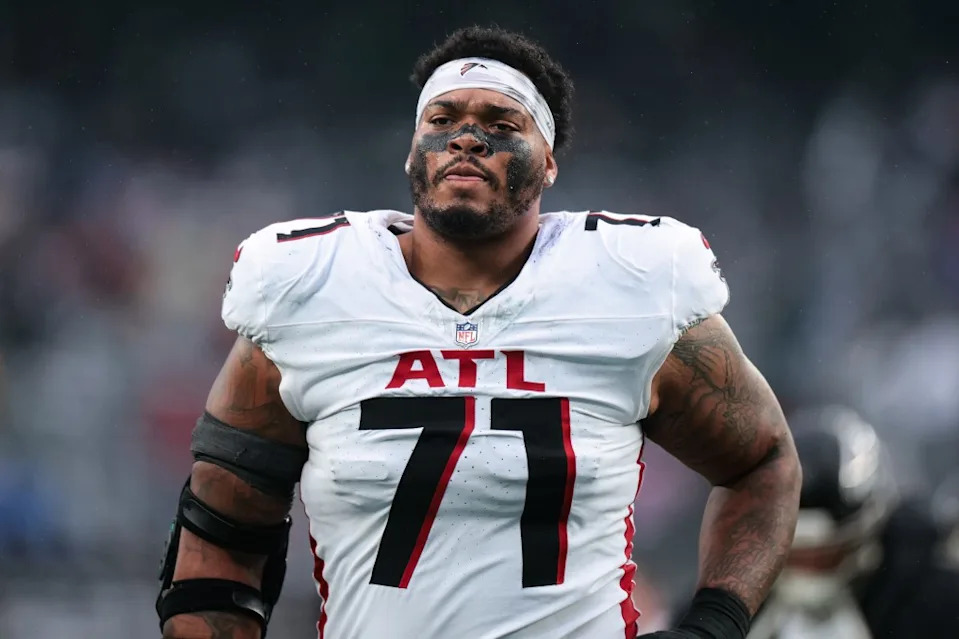 Elijah Wilkinson #71 of the Atlanta Falcons runs off the field for halftime during a game against the New York Jets at MetLife Stadium on November 30, 2025 in East Rutherford, New Jersey. Getty Images