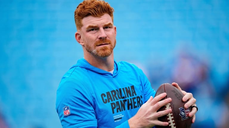 Carolina Panthers quarterback Andy Dalton (14) warms up before an...