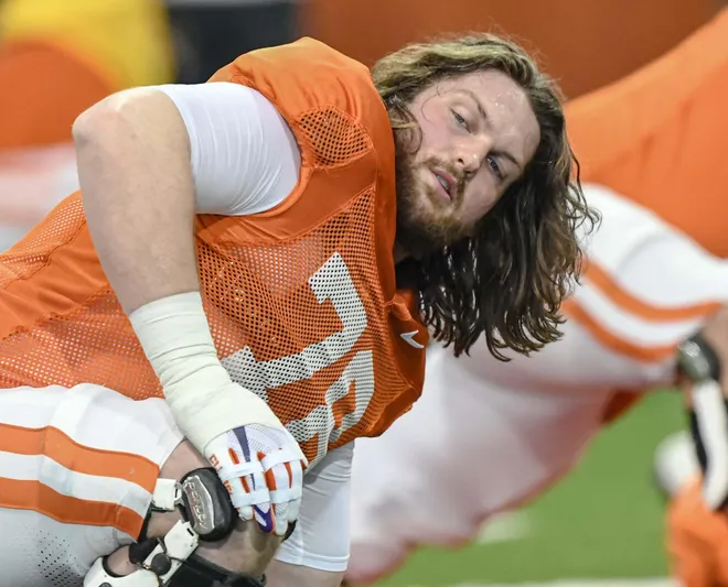 Clemson offensive lineman Blake Miller (78) stretches during the football practice at the Allen N. Reeves Football Complex at Clemson University in Clemson, S.C. Monday, March 3, 2025.