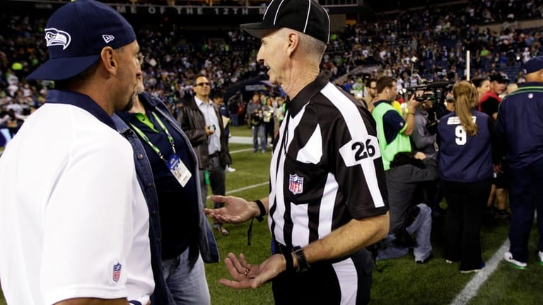 Official Lance Easley (26) gestures on the field following the...