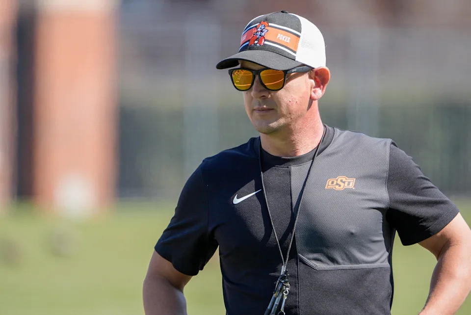 Head coach Eric Morris stands on the field during Oklahoma State football practice in Stillwater, Okla., on Tuesday, March 24, 2026.