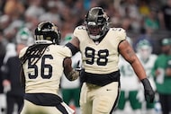New Orleans Saints defensive end Jonathan Bullard (98) celebrates with outside linebacker...