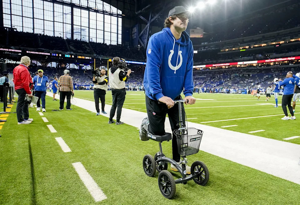 Indianapolis Colts quarterback Daniel Jones moves along the sideline on a scooter Sunday, Dec. 28, 2025, ahead a game against the Jacksonville Jaguars at Lucas Oil Stadium in Indianapolis.
