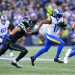 Los Angeles Rams wide receiver Davante Adams (17) runs after a catch against the Seattle Seahawks during the first half in the 2026 NFC Championship Game at Lumen Field.