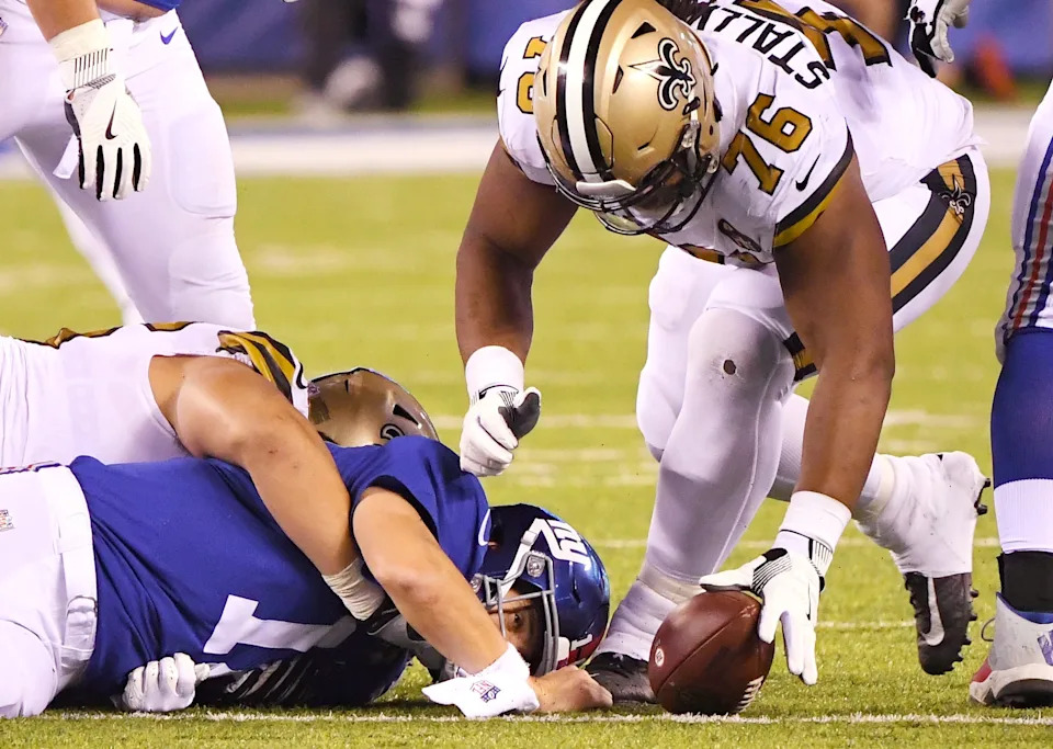 Sep 30, 2018; East Rutherford, NJ, USA; New York Giants quarterback Eli Manning (10) fumbles the ball as New Orleans Saints defensive tackle Taylor Stallworth (76) recovers the loose ball during the 4th quarter at MetLife Stadium. Mandatory Credit: Robert Deutsch-USA TODAY Sports