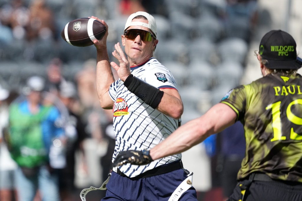 Founders FFC quarterback Tom Brady (12) throws ball against Logan Paul of Wildcats FFC during the Fanatics Flag Football Classic at BMO stadium. 