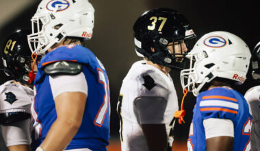 Players shake hands during a line up after Lone Peak was forced to forfeit a high school footba ...