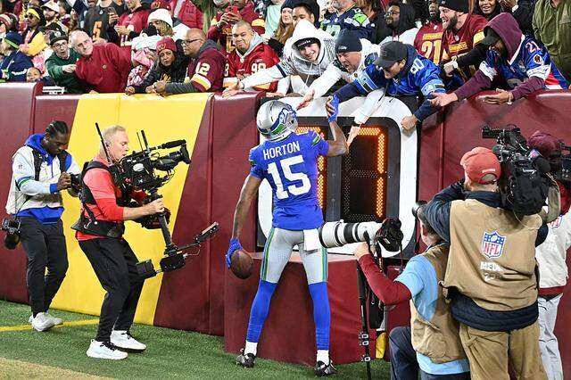 Seattle Seahawks wide receiver Tory Horton (15) celebrates his touchdown catch with Seattle fans during the second quarter against the Washington Commanders in the game at Northwest Stadium on November 02, 2025 in Landover, Maryland. (Photo by Greg Fiume/Getty Images)