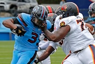Houston Gamblers nose tackle Kyon Barrs (72) gets the face mask of Dallas Renegades running...