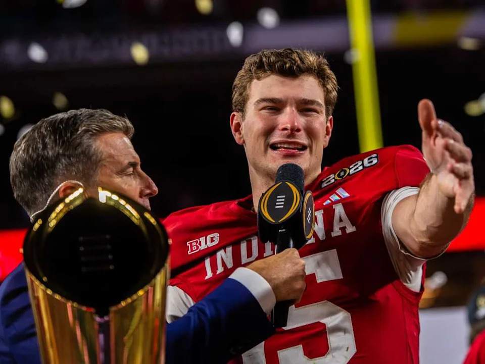 Indiana's Fernando Mendoza (15) talks to the crowd on the podium after the College Football Playoff National Championship college football game at Hard Rock Stadium in Miami Gardens on Monday, Jan. 19, 2026.© Rich Janzaruk/Herald-Times / USA TODAY NETWORK via Imagn Images