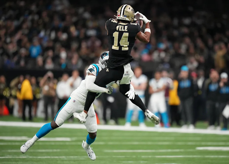 Carolina Panthers cornerback Mike Jackson (2) tackles New Orleans Saints wide receiver Devaughn Vele (14) during the second quarter at Caesars Superdome. Matthew Hinton-Imagn Images