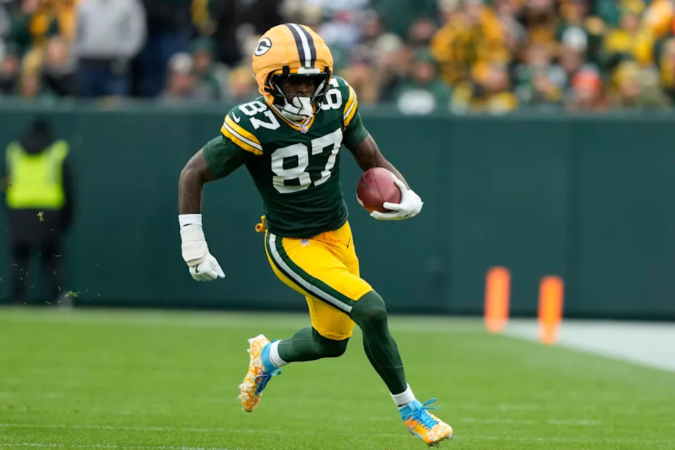 Nov 23, 2025; Green Bay, Wisconsin, USA; Green Bay Packers wide receiver Romeo Doubs (87) carries the ball Minnesota Vikings during the second half at Lambeau Field. Mandatory Credit: Kayla Wolf-Imagn Images.