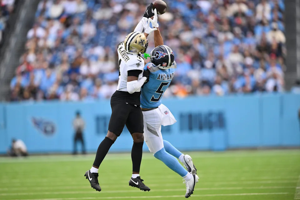 Dec 28, 2025; Nashville, Tennessee, USA; New Orleans Saints cornerback Kool-Aid McKinstry (4) breaks up the pass to Tennessee Titans wide receiver Elic Ayomanor (5) during the second half of the game at Nissan Stadium. Mandatory Credit: Steve Roberts-Imagn Images