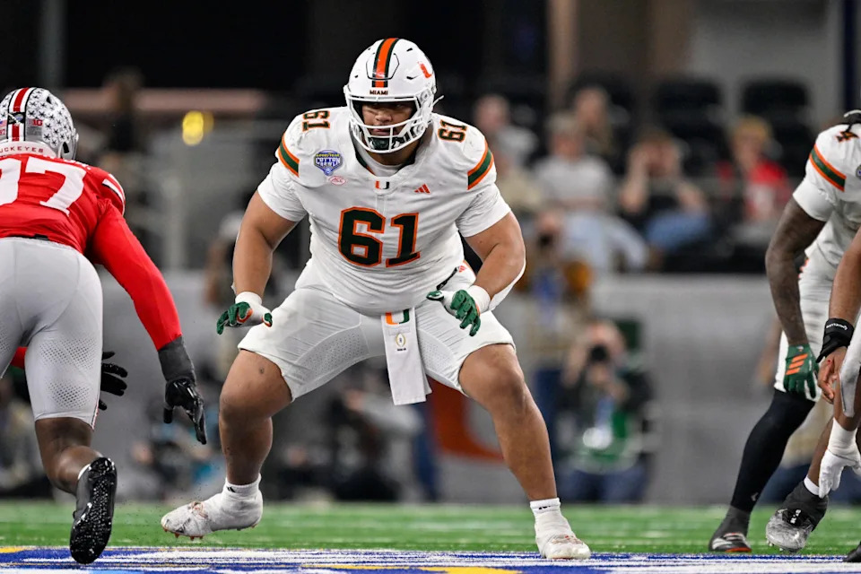 Dec 31, 2025; Arlington, TX, USA; Miami Hurricanes offensive lineman Francis Mauigoa (61) blocks the rush during the 2025 Cotton Bowl and quarterfinal game of the College Football Playoff at AT&T Stadium. Jerome Miron-Imagn Images