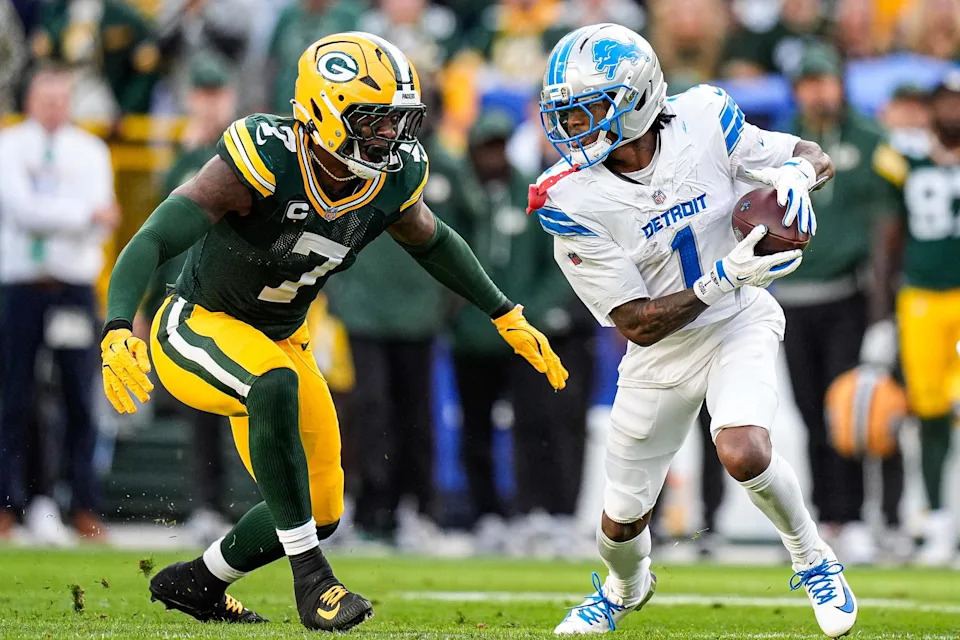 Detroit Lions wide receiver Jameson Williams (1) makes a catch against Green Bay Packers linebacker Quay Walker (7) during the second half at Lambeau Field in Green Bay, Wis., on Sunday, September 7, 2025.&nbsp;© Junfu Han / USA TODAY NETWORK via Imagn Images.