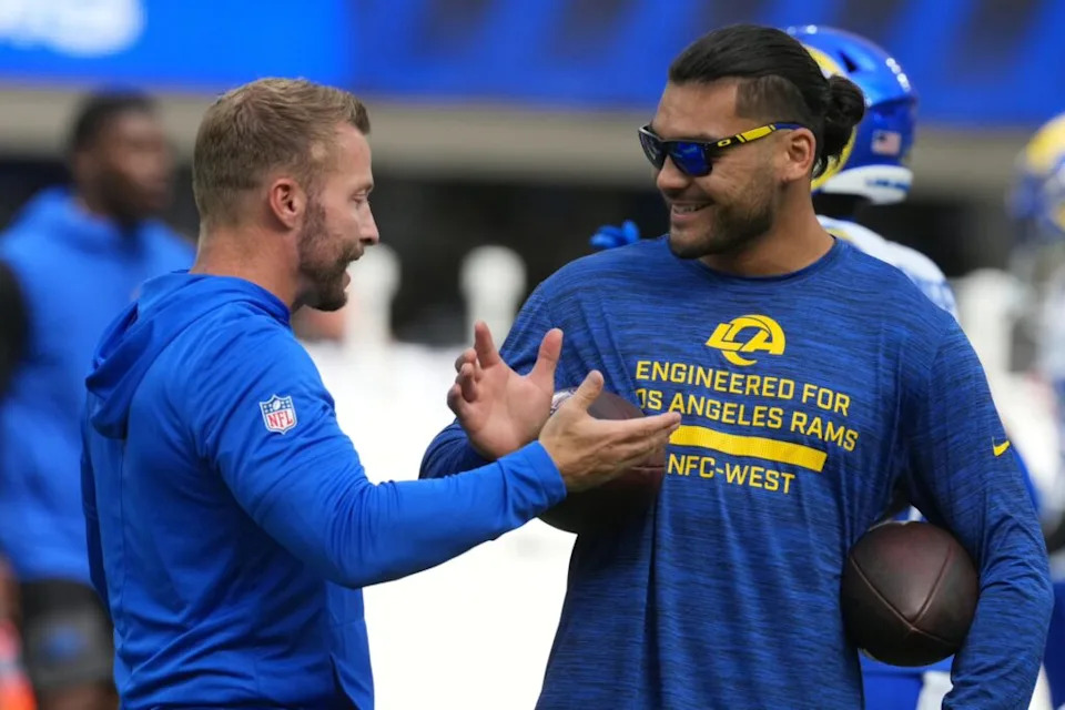 Los Angeles Rams coach Sean McVay (left) talks with wide receiver Puka Nacua (12) against the Los Angeles Chargers in the first half at SoFi Stadium.