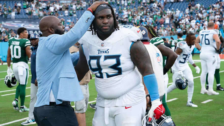 Tennessee Titans General Manager Ran Carthon greets Tennessee Titans defensive tackle T'Vondre Sweat