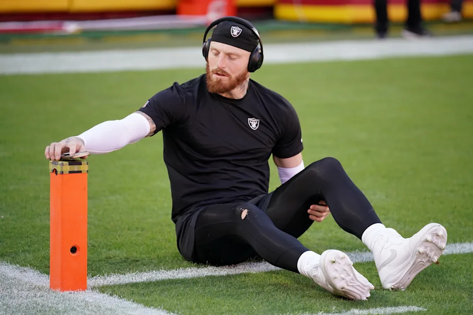 Oct 19, 2025; Kansas City, Missouri, USA; Las Vegas Raiders defensive end Maxx Crosby (98) stretches during warmups prior to the game against the Kansas City Chiefs at GEHA Field at Arrowhead Stadium. Mandatory Credit: Denny Medley-Imagn Images