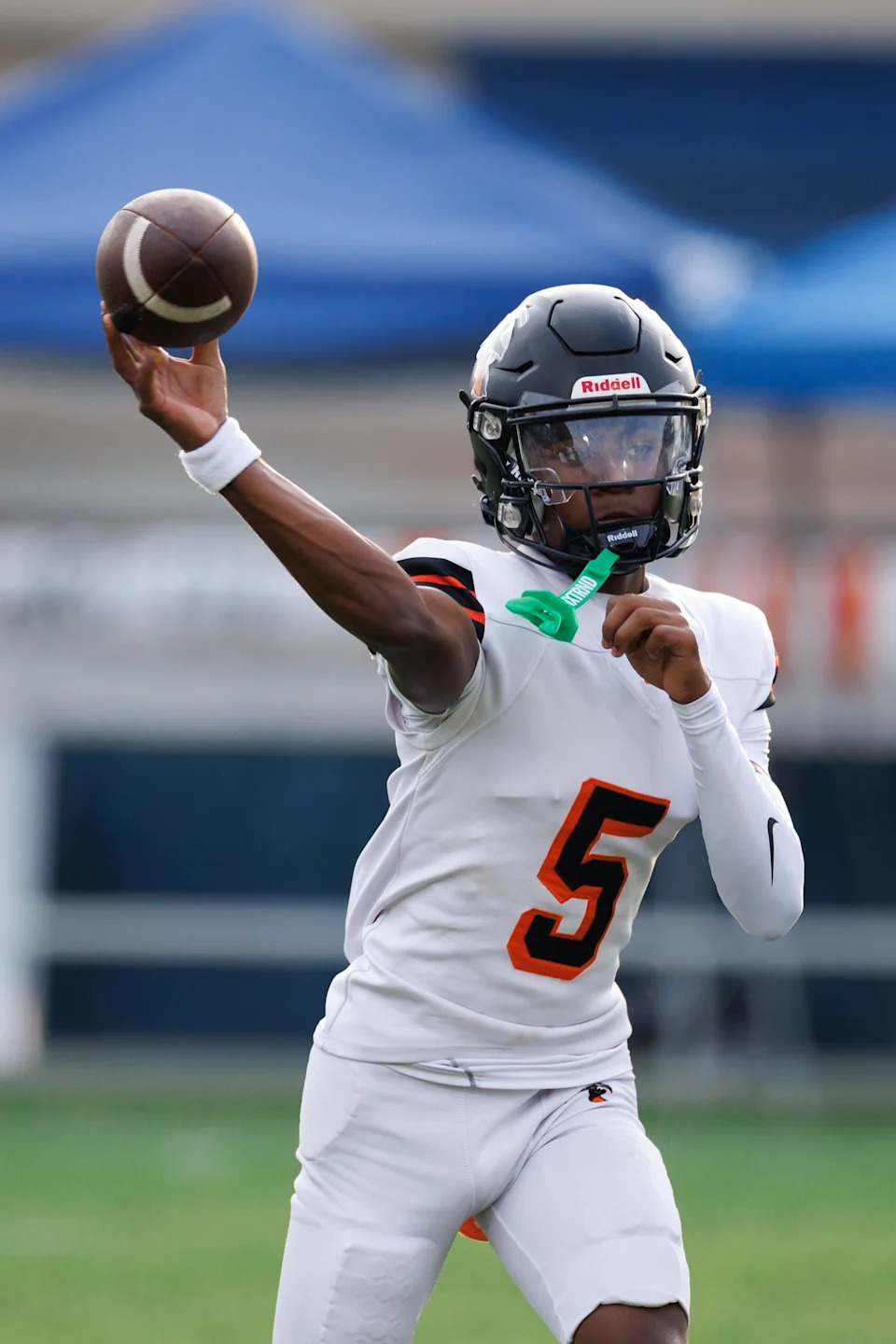 Hawthorne Hornets quarterback Richard Roundtree Jr. (5) throws the ball before a game against the Newberry Panthers at Newberry High School in Newberry, FL on Friday, August 29, 2025. [Matt Pendleton/Gainesville Sun]