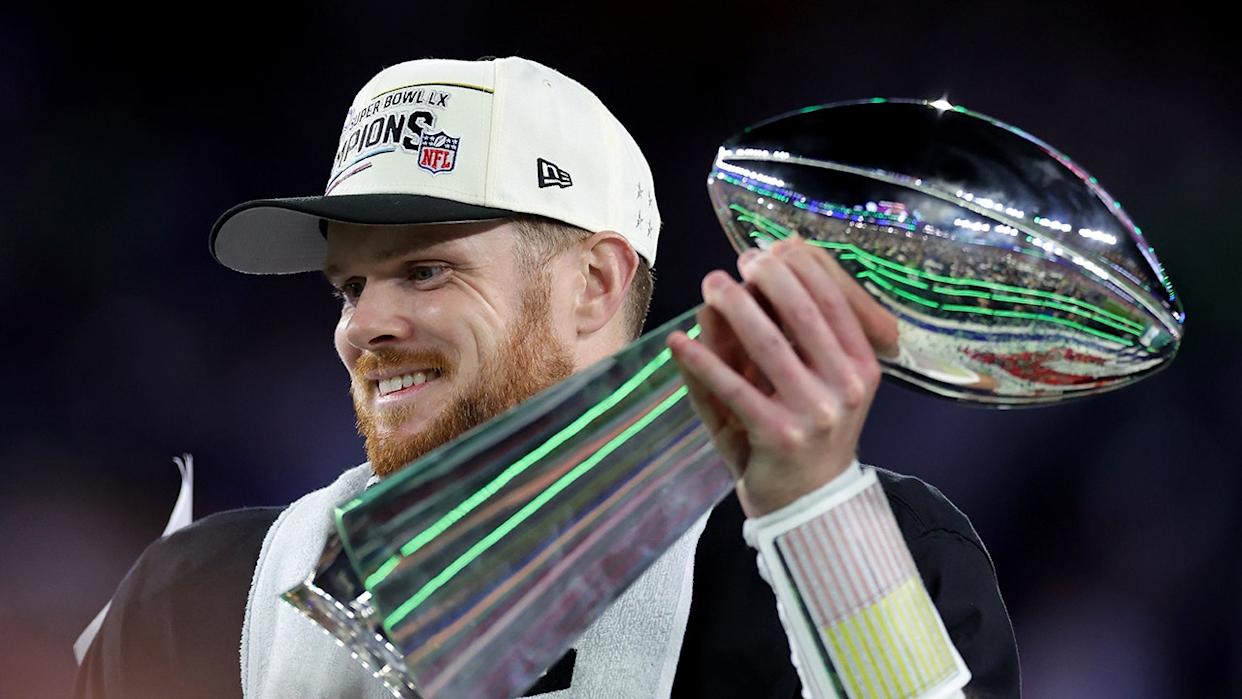 Sam Darnold holds the Vince Lombardi Trophy