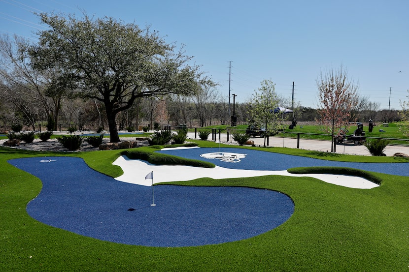 Cowboys-blue turf was used throughout The Huddle, an 18-hole putting course.