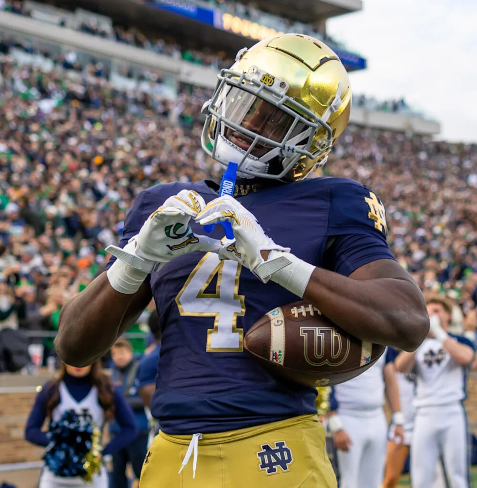Nov 22, 2025; South Bend, Indiana, USA; Notre Dame Fighting Irish running back Jeremiyah Love (4) celebrates scoring against the Syracuse Orange during the first half at Notre Dame Stadium. Mandatory Credit: Michael Caterina-Imagn Images