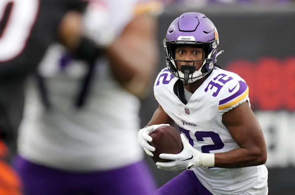CINCINNATI, OHIO - DECEMBER 16: Ty Chandler #32 of the Minnesota Vikings carries the ball in the third quarter of the game against the Cincinnati Bengals at Paycor Stadium on December 16, 2023 in Cincinnati, Ohio. (Photo by Dylan Buell/Getty Images)