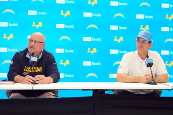 Los Angeles Chargers general manager Joe Hortiz (left) and coach Jim Harbaugh at press conference at The Bolt.