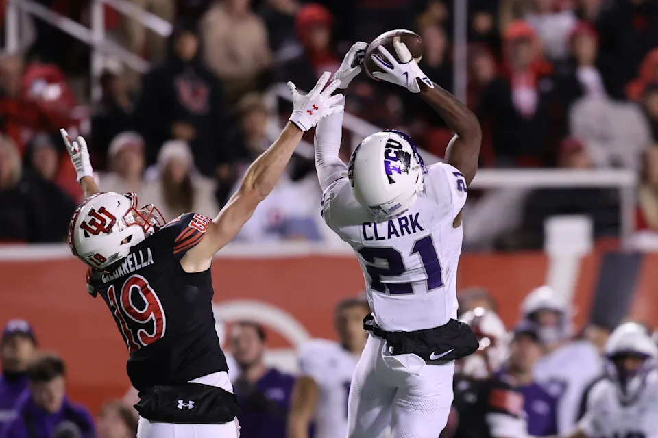 Oct 19, 2024; Salt Lake City, Utah, USA; TCU Horned Frogs safety Bud Clark (21) intercepts a pass intended for Utah Utes wide receiver Luca Caldarella (19) during the fourth quarter at Rice-Eccles Stadium. Mandatory Credit: Rob Gray-Imagn Images