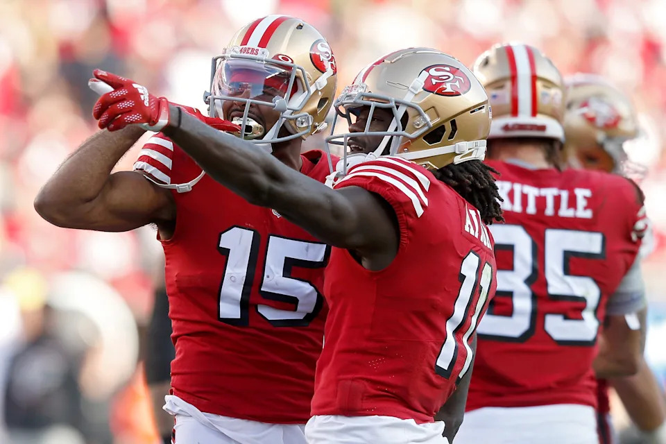 SANTA CLARA, CALIFORNIA - DECEMBER 19: Jauan Jennings #15 and Brandon Aiyuk #11 of the San Francisco 49ers celebrate a first down in the first quarter of the game against the Atlanta Falcons  at Levi's Stadium on December 19, 2021 in Santa Clara, California. (Photo by Lachlan Cunningham/Getty Images)