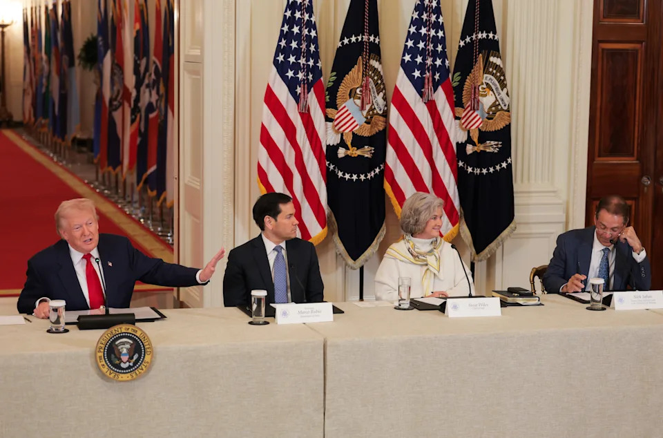 WASHINGTON, DC - MARCH 06: U.S. President Donald Trump (L) gestures as former head coach Nick Saban (R) speaks alongside U.S. Secretary of State Marco Rubio and White House Chief of Staff Susie Wiles during a roundtable discussion on college sports in the East Room of the White House on March 06, 2026 in Washington, DC. The Trump administration held the roundtable titled "Saving College Sports" with leaders from the Power Four conferences, media executives and former coaches. (Photo by Anna Moneymaker/Getty Images)