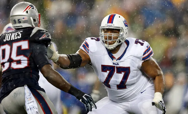 Dec 29, 2013; Foxborough, MA, USA; Buffalo Bills tackle Cordy Glenn (77) blocks New England Patriots defensive end Chandler Jones (95) during the second quarter at Gillette Stadium. Mandatory Credit: Winslow Townson-USA TODAY Sports
