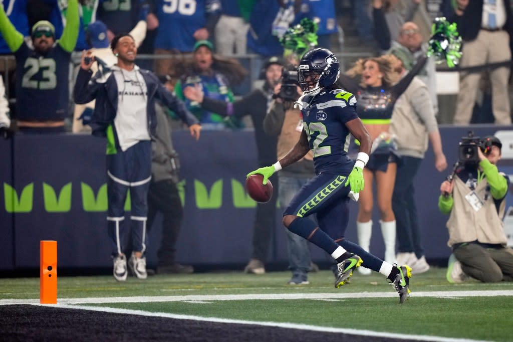 Seattle Seahawks wide receiver Rashid Shaheed runs a kickoff return in for a touchdown during the first half of an NFL football divisional playoff game against the San Francisco 49ers. AP