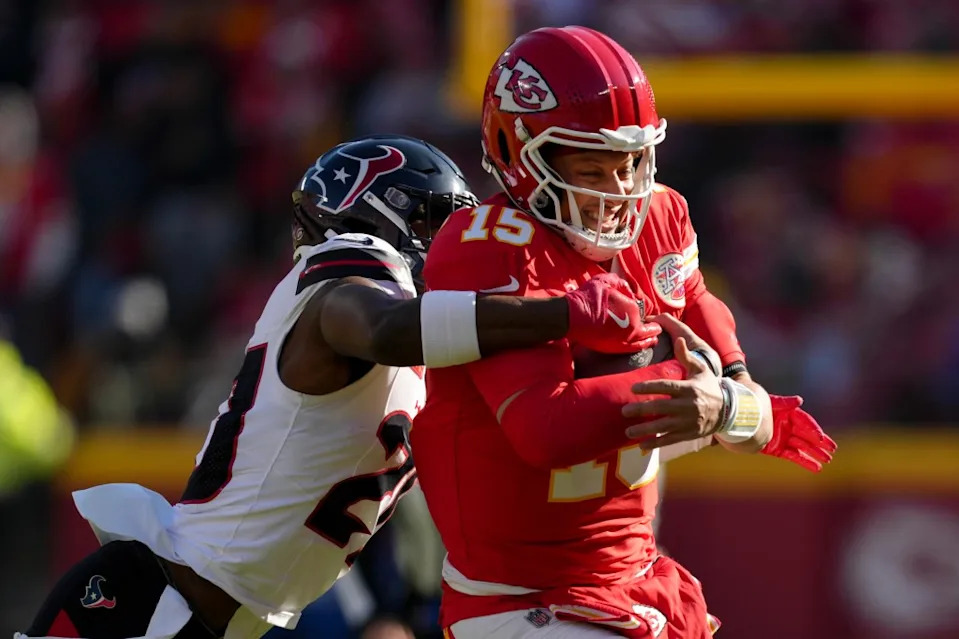 Jimmie Ward #20 of the Houston Texans tackles Patrick Mahomes #15 of the Kansas City Chiefs in the first quarter of a game at GEHA Field at Arrowhead Stadium on December 21, 2024 in Kansas City, Missouri. Getty Images