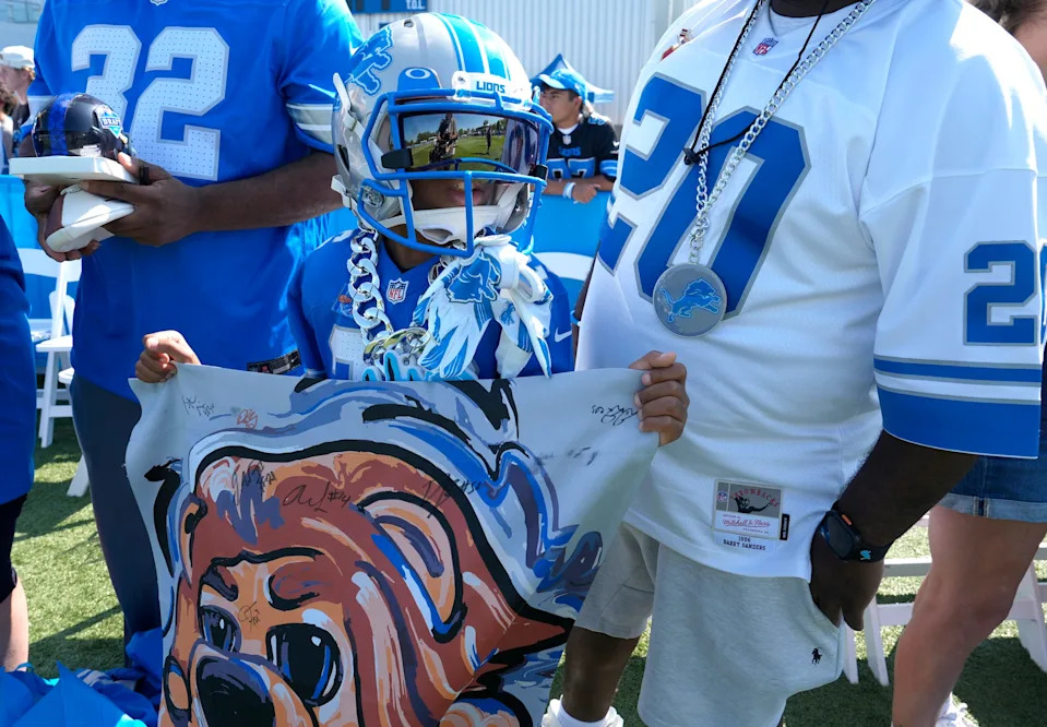 Detroit Lions fan Elijah Shaw, 9 of Detroit and a fan of Lions running back Jahmyr Gibbs wore his Gibbs uniform hoping he would sign it for him after practice at the Lions practice facility in Allen Park on Saturday, July 27, 2024.
This was the first time during this training camp that fans were allowed to watch practice and stay afterwards to see the players up close.