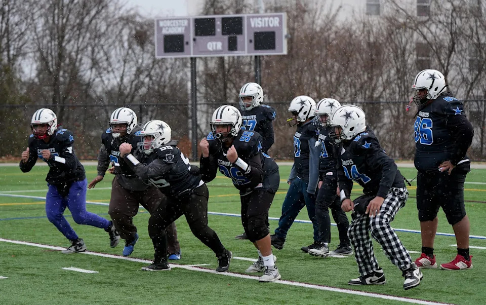 <p>Players from the Worcester Cowboys 12U football team during a practice as the team prepares to play in the American Youth Football (AYF) National Championship.</p>