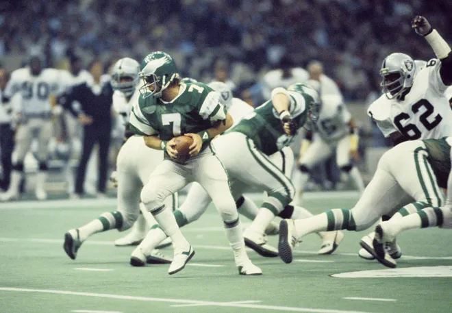 Jan 25, 1981; New Orleans, LA, USA; FILE PHOTO; Philadelphia Eagles quarterback Ron Jaworski (7) steps back in the pocket pursued by Oakland Raiders tackle Reggie Kinlaw (62) during Super Bowl XV at the Superdome. The Raiders defeated the Eagles 27-10. Mandatory Credit: Malcolm Emmons-USA TODAY Sports