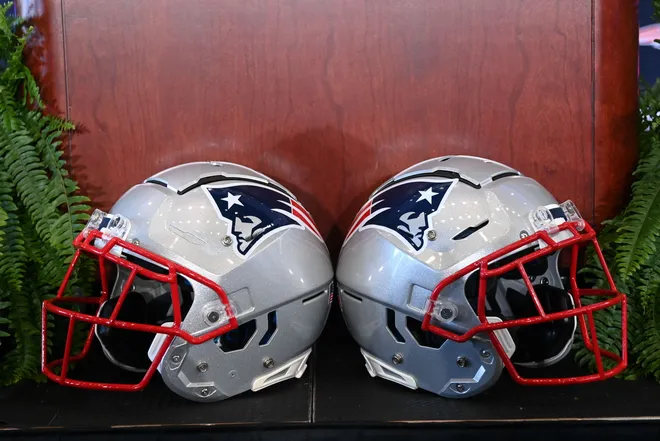 A pair of New England Patriots helmets.