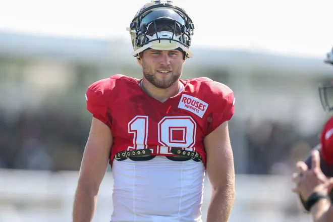 Jul 28, 2025; Metairie, LA, USA; New Orleans Saints quarterback Hunter Dekkers (18) looks on at Ochsner Sports Performance Center. Mandatory Credit: Stephen Lew-Imagn Images