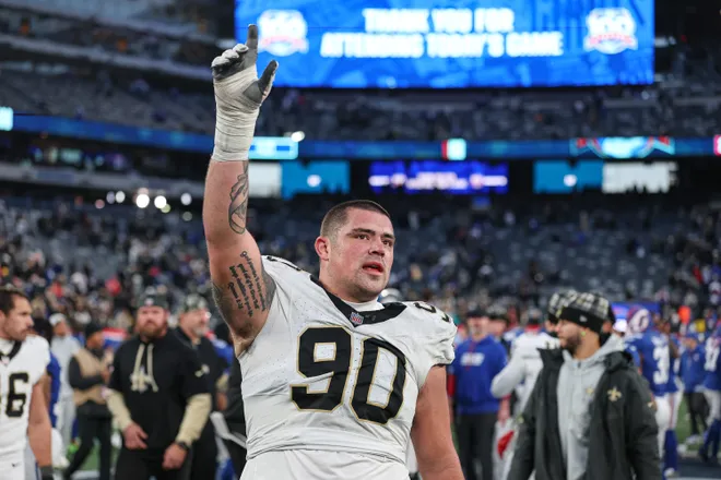 Dec 8, 2024; East Rutherford, New Jersey, USA; New Orleans Saints defensive tackle Bryan Bresee (90) celebrates after the game against the New York Giants at MetLife Stadium. Mandatory Credit: Vincent Carchietta-Imagn Images
