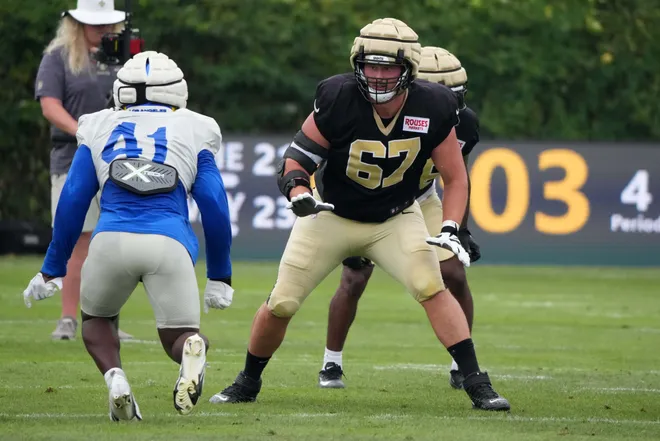 Aug 14, 2025; Carson, CA, USA; New Orleans Saints offensive tackle Landon Young (67) defends against Los Angeles Rams linebacker Josaiah Stewart (41) during a joint practice at the Dignity Health Sports Park. Mandatory Credit: Kirby Lee-Imagn Images