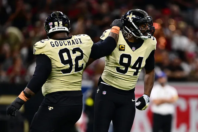 NEW ORLEANS, LOUISIANA - SEPTEMBER 07: Cameron Jordan #94 of the New Orleans Saints celebrates with Davon Godchaux #92 after sacking Kyler Murray #1 of the Arizona Cardinals (not pictured) during the game at Caesars Superdome on September 07, 2025 in New Orleans, Louisiana. (Photo by Ella Hall/Getty Images)