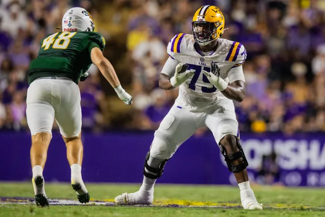 Sep 20, 2025; Baton Rouge, Louisiana, USA; LSU Tigers offensive tackle Weston Davis (75) blocks Southeastern Louisiana Lions defensive lineman Max Elkman (48) during the first half at Tiger Stadium. Mandatory Credit: Stephen Lew-Imagn Images